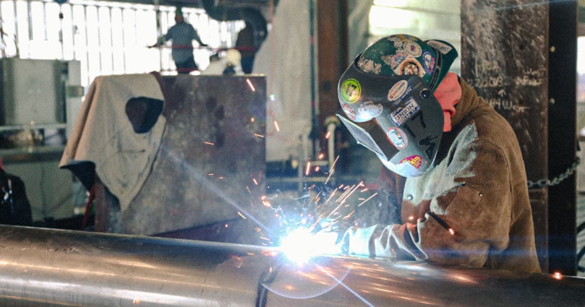 a McCusker-Gill employee prefabricating HVAC equipment in their shop
